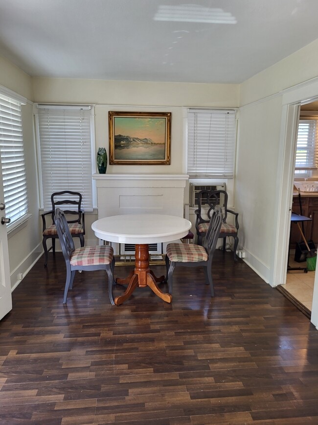 Dining table with 4 chairs, leaf out back. - 3020 E 17th St
