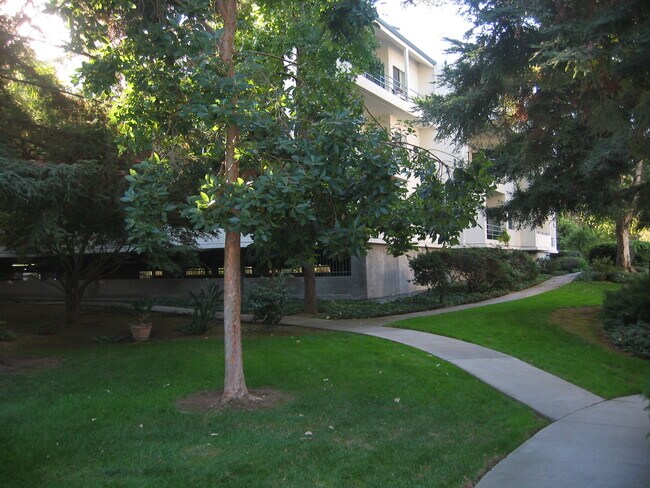 Shady walk way between buildings - 4685 Albany Cir