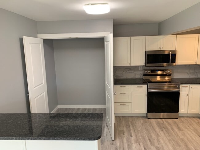 pantry (metal shelving being installed) - 5350 Camelot Dr