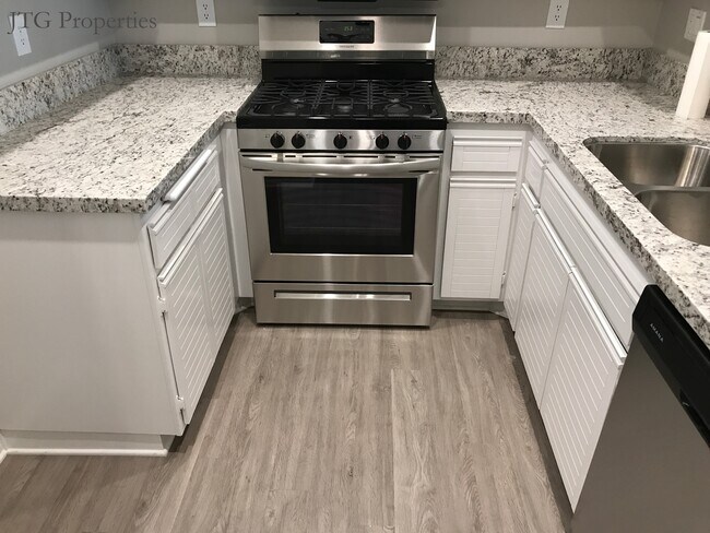 Kitchen with vinyl plank floors - 24117 Del Monte Dr