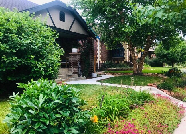 Beautiful perennial gardens in front , Lovely covered porch! - 4030 Quitman St