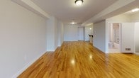 Located at 75 Lackawanna Ave in Totowa, NJ, this well-appointed one-bedroom, one-bathroom residence offers a thoughtfully designed single-floor layout. Warm-toned hardwood floors run seamlessly throughout, lending a cohesive and inviting feel to every room.

The expansive open living area is generously proportioned, bathed in natural light from large windows, and flows effortlessly from one end of the unit to the other — ideal for both relaxing and entertaining. Neutral-toned walls complement the bright, airy atmosphere throughout.

The kitchen is a functional highlight, featuring rich dark-wood cabinetry, granite countertops with a stone tile backsplash, a gas range, built-in microwave, and a stainless steel sink — a well-equipped space for everyday cooking.

The bedroom is comfortably sized with continued hardwood flooring and access to a walk-in closet, offering ample storage. The full bathroom is clean and modern, appointed with a granite-topped white vanity, tile flooring, and a tub/shower combination with sliding glass doors.

A dedicated in-unit laundry closet houses a full-size washer and dryer, adding everyday convenience. The overall design is clean, modern, and move-in ready, making this a practical and comfortable home in Totowa, NJ.