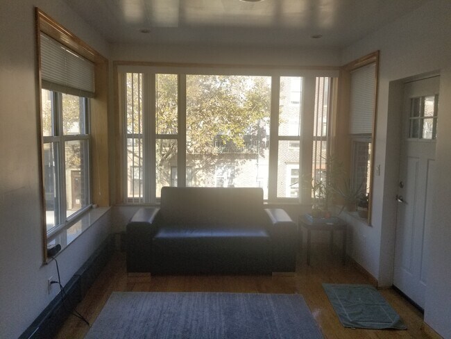 large window front, facing natural light and nature. - 330 68th St