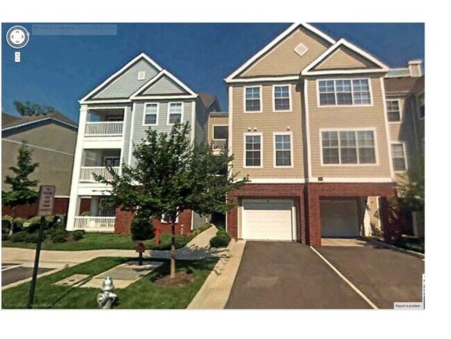 Front of building, home in back faces trees for privacy - 614 Bristol Village Dr