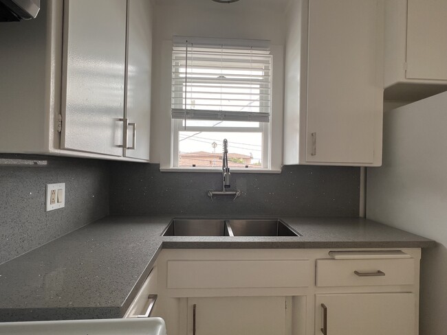 New kitchen counters and faucet. Freshly painted cabinets - 227 Calle Miramar