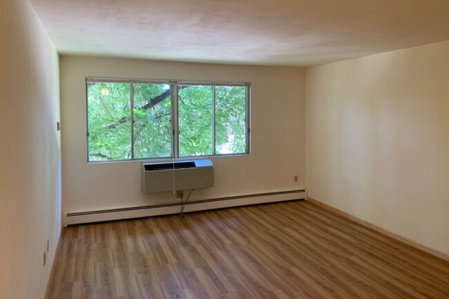 Living Room in Unit w Laminate Flooring - Hilldale Towers