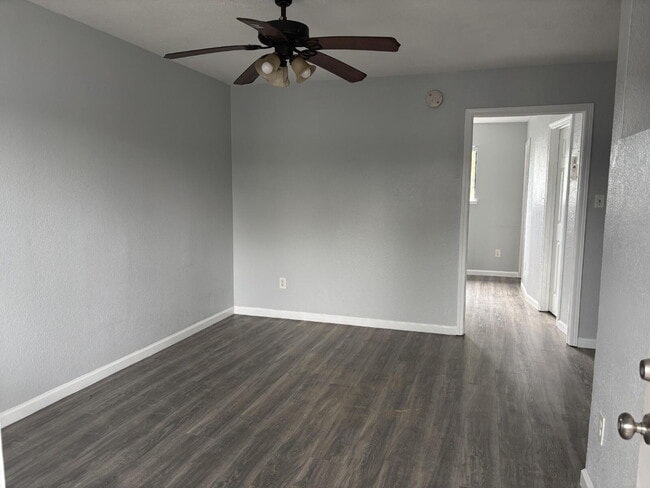 Building Photo - Corner & 1st Floor - Location, location, location! Become the newest neighbor at Palm Garden Apar...