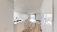 This 420 square foot apartment in Newport Beach offers a thoughtfully designed living space that maximizes efficiency and comfort. The open floor plan creates a sense of spaciousness, with the living area seamlessly flowing into the kitchen. The kitchen features modern appliances, including a refrigerator and stove, with light-colored cabinetry that enhances the bright, airy feel of the space.

The apartment boasts beautiful hardwood flooring throughout, adding warmth and elegance to the interior. Large sliding glass doors in the main living area lead to a private balcony, allowing natural light to flood the space and providing an outdoor extension for relaxation or entertaining.

The bedroom area, while compact, offers ample storage with built-in closets and shelving. The bathroom is well-appointed with modern fixtures and a clean, white color scheme. A ceiling fan in the main living area helps with air circulation and comfort.

The unit's design incorporates clever storage solutions, including built-in shelving and cabinets, to make the most of the available space. The neutral color palette of whites and light tones contributes to the apartment's fresh, contemporary aesthetic. This Newport Beach apartment is an ideal choice for those seeking a stylish, low-maintenance living space in a desirable coastal location.