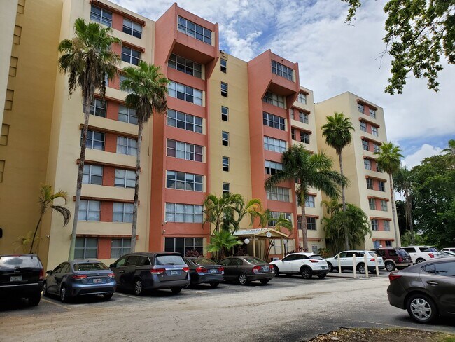 building with elevator and a lot of parking space - 9001 SW 77th Ave