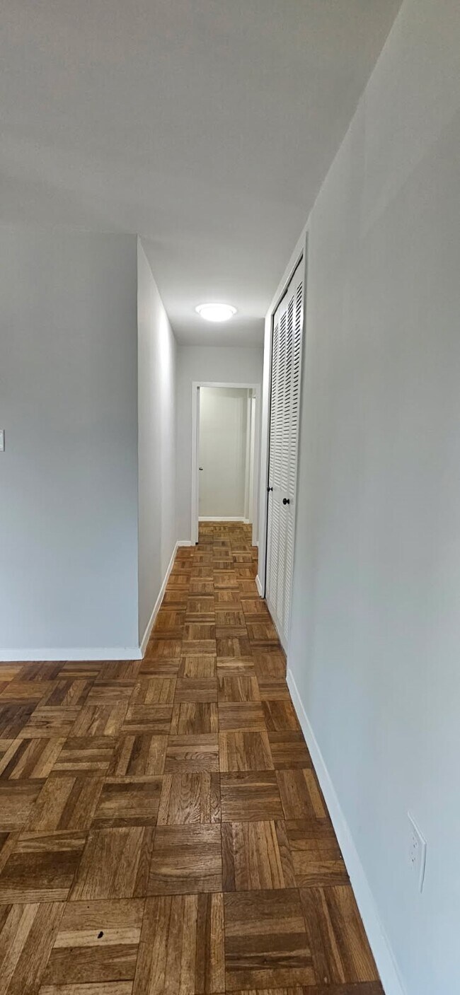 hallway from living room to bathroom and bedrroms - 4000 Tunlaw Rd NW