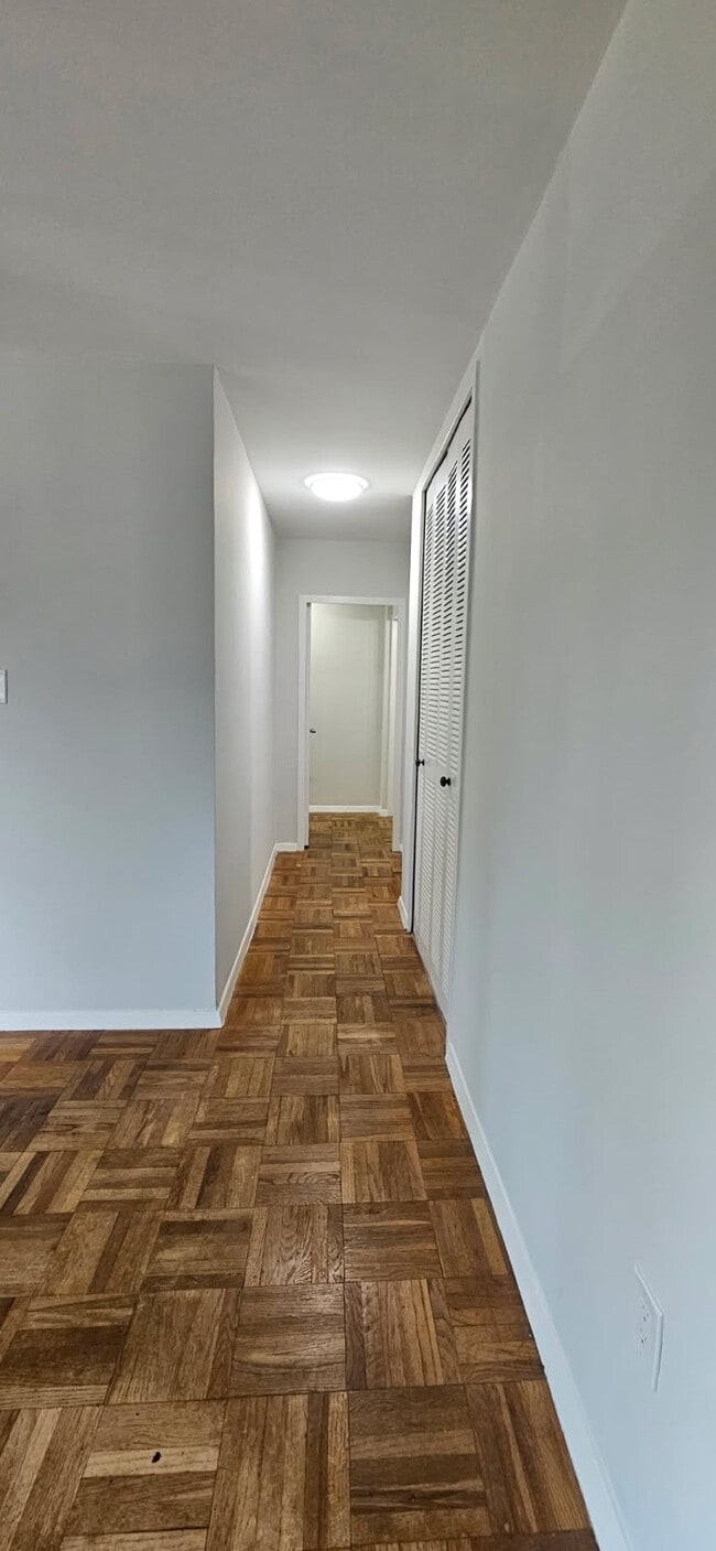 hallway from living room to bathroom and bedrroms - 4000 Tunlaw Rd NW