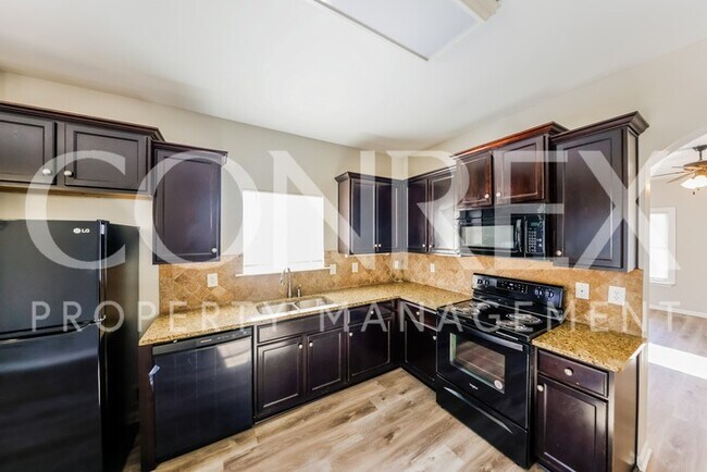 Building Photo - Beautiful Spacious Four Bedroom -- One Mon...