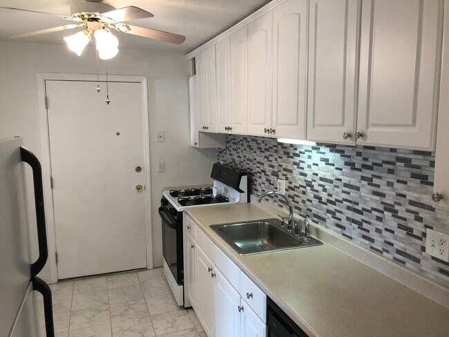 Kitchen sink and stove, new cabinets. - 395 Merrimack St