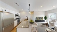 Step into a world of possibility in this beautifully designed 2-bedroom apartment. With 610 square feet of thoughtfully crafted living space, this urban retreat offers the perfect blend of style and functionality. The heart of the home is a stunning open-concept kitchen, where gleaming white cabinetry and sleek stainless-steel appliances create a chef's paradise. Imagine preparing gourmet meals or entertaining friends in this inviting space, where form and function harmonize seamlessly.

The primary bedroom, a generous 150 square feet, is a serene sanctuary bathed in natural light from large windows that frame picturesque city views. The second bedroom offers versatility as a guest room, home office, or personal gym, adapting to your lifestyle needs. Both rooms feature warm wood-tone flooring that adds a touch of elegance and comfort throughout the apartment.

The modern bathroom is a spa-like retreat, boasting a pristine white palette with contemporary fixtures and a spacious tub-shower combination. Ample storage solutions, including a dedicated closet, ensure clutter-free living and organization.

Recessed lighting throughout creates a warm ambiance, while the neutral color scheme provides a blank canvas for your personal style. This apartment isn't just a space; it's an invitation to live the urban lifestyle you've always dreamed of. Located in the vibrant heart of Lansing at 845 S Washington Ave, you're steps away from local attractions, dining, and culture. Embrace the energy of city living while having a tranquil haven to call your own. Your aspirational urban lifestyle begins here – welcome home.
