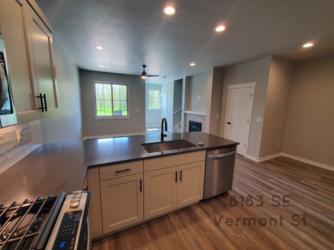 Spacious kitchen with quartz countertop and stainless steel appliances - 8183 SE Vermont St