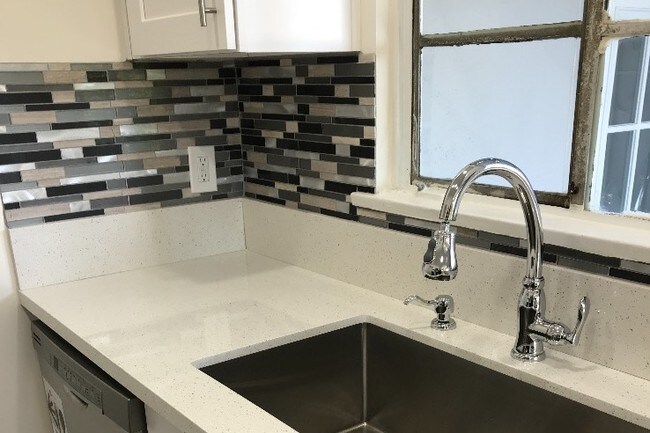 Glass backsplash in kitchen with Farm sink - 1900 Lincoln Ave