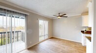 Located at 809–811 Southampton Rd in Benicia, CA, this one-bedroom, one-bathroom unit offers a well-organized single-floor layout designed for comfortable everyday living. The living room is bright and open, featuring light wood-style flooring, crown molding, a textured ceiling, and a ceiling fan. Sliding glass doors with vertical blinds lead to a private balcony, filling the space with natural light and providing outdoor access. The galley-style kitchen is efficiently designed with crisp white cabinetry, dark quartz countertops, stainless steel appliances including a refrigerator and electric range, and hardwood-style flooring. The bedroom is carpeted and comfortably sized, with a window dressed in vertical blinds that brings in natural light. Neutral-toned walls and a textured ceiling carry throughout the bedroom, creating a calm and restful atmosphere. The bathroom includes a full tub-shower combination with tiled surround and wood-style flooring. A dedicated laundry room with a full-size washer and dryer adds everyday convenience. A hallway connects the rooms cohesively, completing this functional and well-appointed unit in a desirable Benicia location.