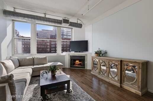 Living room and fireplace - 161 W Harrison St