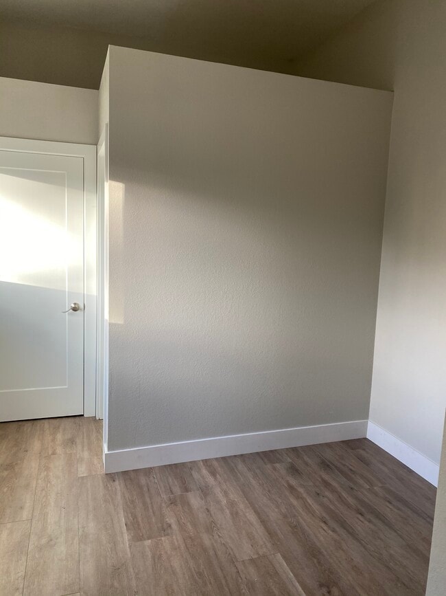 Closet and bathroom wall; bed area - 238 colfax ave