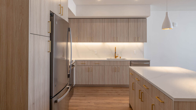 Kitchen with Stainless Steel Appliances and Quartz Countertops - Lorien