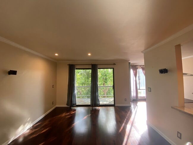 Living room with Built-in Stereo Speakers - 4 Admiral Dr Apartment