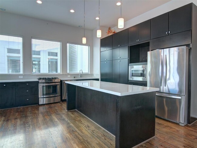 Kitchen with Jenn-Air stainless steel appliances and quartz countertops - 2719 Clay St