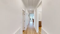 Located in Tanner, Alabama, this well-appointed single-story home offers a thoughtfully designed layout with one bedroom, two bathrooms, two dedicated office spaces, and a combined kitchen and living area. The interior features a clean, modern aesthetic with crisp white walls, light wood-style flooring in key areas, and an abundance of natural light through slatted blinds across multiple windows.

The open kitchen is a functional highlight, showcasing warm taupe cabinetry, white countertops, stainless steel appliances including a refrigerator, range, microwave, and dishwasher, plus pendant lighting over the sink area. The adjacent living room offers a bright, comfortable setting with carpet flooring, a ceiling fan, and a glass door providing views and access to the outdoors.

The primary bedroom features a tray ceiling, ceiling fan, large windows with outdoor views, and light wood flooring. Both bathrooms are clean and functional, with one featuring a full tub-shower combination with brushed nickel fixtures.

The two office spaces are well-lit with natural light and light wood flooring, accommodating a range of work-from-home needs. A dedicated laundry room with washer/dryer hookups, built-in shelving, and two closets round out the practical layout of this move-in ready home.