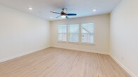 Located at 2750 Gathering Pl in Midlothian, TX, this thoughtfully designed two-story home offers 3 bedrooms, 4 bathrooms, and a functional layout spread across two floors. The ground floor features a welcoming entrance that opens into a combined kitchen and living area, showcasing light hardwood-style flooring throughout. The kitchen is a standout, equipped with white shaker cabinetry, granite countertops, a large center island with a deep undermount sink, subway tile backsplash, and stainless steel appliances including a refrigerator, range, and microwave. The upper floor hosts all three bedrooms, each featuring neutral tones and window blinds that allow for natural light. The primary bedroom is generously sized with multiple windows and a ceiling fan, while the secondary bedrooms offer plush carpeting or hardwood flooring. The primary bathroom is elegantly appointed with marble-style tile flooring, a dual-sink vanity with white cabinetry, and a glass-enclosed walk-in shower. Additional bathrooms include marble-tile tub/shower combinations. A dedicated laundry area with a full-size washer and dryer adds everyday convenience. The home's clean, modern aesthetic and efficient layout make it a well-appointed residence in the Midlothian community.