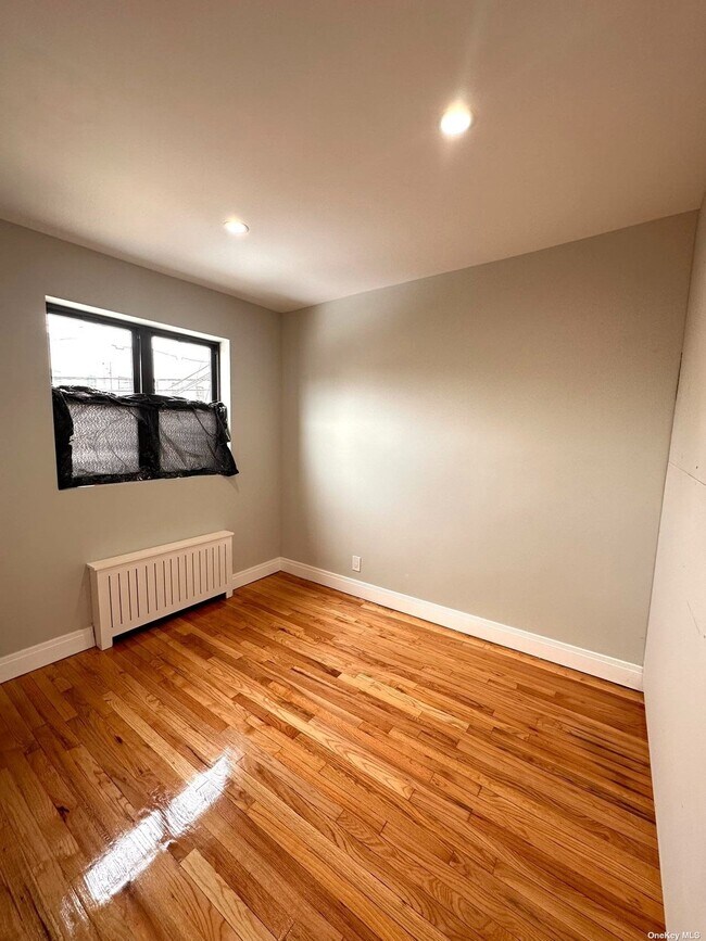 Building Photo - 64-11 60th Pl