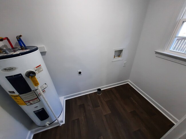 Laundry/mud room conveniently located off of kitchen next to back door. - 1717 Old Barn Rd