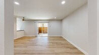 Located at 800 Saint Charles Dr in Thousand Oaks, CA, this thoughtfully designed 2-bedroom, 1-bathroom single-floor home offers a clean, modern aesthetic throughout. Light wood-tone flooring runs seamlessly across every room, complementing the bright white walls and recessed lighting that keep the space feeling open and airy.

The combined living and dining area serves as the heart of the home, featuring a ceiling fan and a sliding glass door that opens directly onto a private balcony, allowing natural light to pour in and creating a smooth indoor-outdoor flow. The kitchen is well-appointed with white shaker cabinetry, dark countertops, a white subway tile backsplash, and stainless steel appliances including a range, microwave, and refrigerator. A window above the counter brings in additional natural light.

Both bedrooms are comfortably sized with large windows offering views of the surrounding natural landscape. The primary bedroom includes a mirrored sliding closet and a wall-mounted mini-split HVAC unit for individual climate control. The second bedroom also features a dedicated mini-split unit. With four closets throughout, storage is plentiful.

The bathroom is finished with white cabinetry, dark countertops, gold-toned hardware, and a full tub-shower combination. A hallway connects all rooms efficiently, completing this well-organized and move-in-ready home.