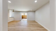 Located at 800 Saint Charles Dr in Thousand Oaks, CA, this thoughtfully designed 2-bedroom, 1-bathroom single-floor home offers a clean, modern aesthetic throughout. Light wood-tone flooring runs seamlessly across every room, complementing the bright white walls and recessed lighting that keep the space feeling open and airy.

The combined living and dining area serves as the heart of the home, featuring a ceiling fan and a sliding glass door that opens directly onto a private balcony, allowing natural light to pour in and creating a smooth indoor-outdoor flow. The kitchen is well-appointed with white shaker cabinetry, dark countertops, a white subway tile backsplash, and stainless steel appliances including a range, microwave, and refrigerator. A window above the counter brings in additional natural light.

Both bedrooms are comfortably sized with large windows offering views of the surrounding natural landscape. The primary bedroom includes a mirrored sliding closet and a wall-mounted mini-split HVAC unit for individual climate control. The second bedroom also features a dedicated mini-split unit. With four closets throughout, storage is plentiful.

The bathroom is finished with white cabinetry, dark countertops, gold-toned hardware, and a full tub-shower combination. A hallway connects all rooms efficiently, completing this well-organized and move-in-ready home.