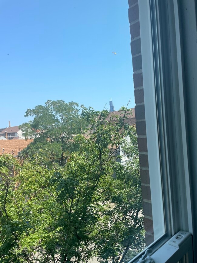 Peek of downtown from building - 1527 W 18th St