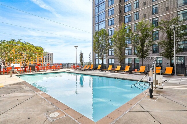 the swimming pool and deck chairs - Arrive Wheaton