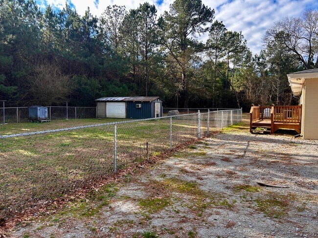 Building Photo - NOW AVAILABLE! 3 Bedrooms/1 1/2 Bath with Double living room space.