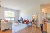 Located at 75 Huron Heights Dr in Newmarket, Ontario, this 2-bedroom, 1-bathroom unit offers a thoughtfully laid-out single-floor plan that makes efficient use of its space. Warm hardwood flooring flows throughout the living areas and bedrooms, creating a cohesive and inviting atmosphere.

The kitchen is well-equipped with ample white cabinetry, granite-style countertops, a double sink, and full-sized appliances, including a refrigerator and stove. Light tile flooring and generous storage make this an easy-to-use, practical space.

The primary bedroom is a comfortable retreat, featuring a textured ceiling, a centered window with views of surrounding greenery, and room for a full furniture arrangement. A dedicated closet with dual hanging rods provides practical storage. The second bedroom also benefits from a window with natural light and outdoor views, with warm hardwood flooring and clean neutral walls.

The bathroom features a full tub and shower combination with white tile surround, maintaining a clean and functional aesthetic. A central hallway connects all rooms efficiently.

The overall ambiance is bright and neutral, with white walls, natural light from multiple windows, and warm wood tones underfoot — creating a calm, move-in-ready environment.