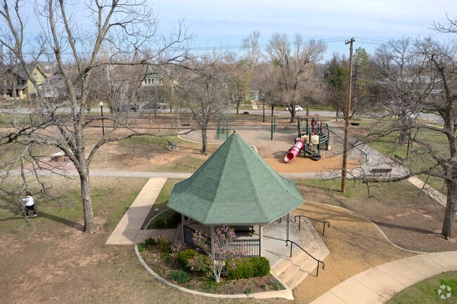 Sit in some shade as the kids play on the jungle gym