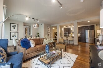 Seamless flow between the cozy living space and modern kitchen - Pearl Residences