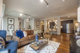 Seamless flow between the cozy living space and modern kitchen - Pearl Residences