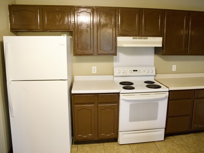 Kitchen with lots of cabinets and high ceilings. - 8016 Zane Ave N