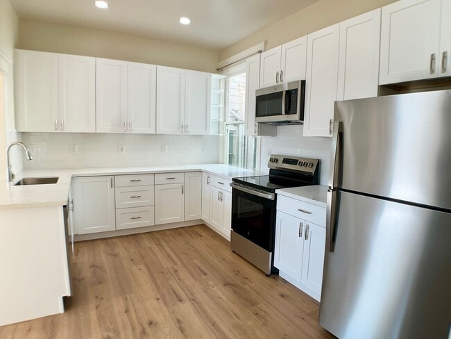 Photo - REMODELED 4BR/3BA. In Unit Laundry! Dishwasher! Bay Windows! Apartment