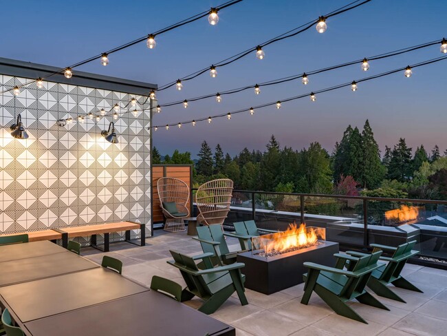 Cozy up at Modera Woodstock's outdoor terrace, complete with a welcoming firepit for year-round gatherings. - Modera Woodstock