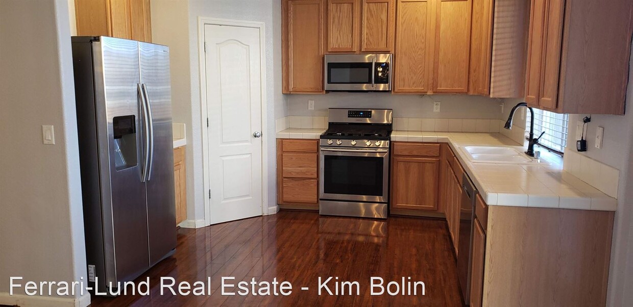 Building Photo - 4 br, 2.5 bath House - 7422 Windswept Loop