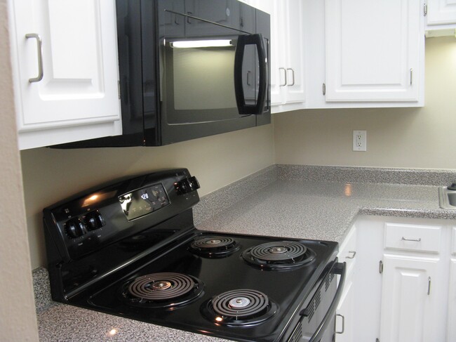 Upgrade with Black Appliances - West Hills Village Apartments