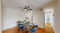 Located at 8600 16th St in Silver Spring, MD, this well-appointed one-bedroom, one-bathroom residence offers a thoughtfully designed single-floor layout. Warm parquet hardwood flooring flows throughout the main living areas, lending a classic character to the space.

The living room is bright and open, featuring a large window with vertical blinds that fills the room with natural light and offers outdoor views. The adjacent dining area accommodates a full dining set and includes a ceiling fan with integrated lighting, enhancing both comfort and airflow.

The kitchen is efficiently laid out with light wood cabinetry, dark granite countertops, tile flooring, and a full suite of black appliances including a gas range, microwave, dishwasher, and refrigerator — providing ample functionality for everyday cooking.

The bedroom is a comfortable retreat, featuring large windows with outdoor views, sliding mirrored closet doors, and the same warm parquet flooring. A dedicated office space with a sizable window brings in natural light, making it ideal for remote work or study.

The bathroom is clean and classic, finished with white subway tile wainscoting and a shower-tub combination. Throughout the residence, neutral wall tones and consistent flooring create a cohesive, inviting atmosphere.