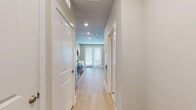 Located at 7777 Manderville Ln in Dallas, TX, this efficiently designed single-floor studio offers a thoughtfully organized layout that maximizes every square foot. The open-concept living area is anchored by light wood-look flooring that runs throughout the space, complemented by soft neutral wall tones and recessed lighting that create a clean, airy ambiance. A ceiling fan with integrated lighting in the main living area enhances comfort, while a set of French doors and an adjacent window flood the room with natural light and provide access to the outdoors.

The contemporary kitchen is a standout feature, showcasing a sleek two-tone design with warm wood lower cabinetry paired with crisp white upper cabinets and black hardware. A textured gray scallop-patterned tile backsplash adds visual interest, while white quartz countertops provide a clean work surface. Stainless steel appliances — including a refrigerator, range, microwave, and dishwasher — complete the modern culinary setup. A dedicated pantry offers additional storage convenience.

The bathroom is finished with light tile flooring and features a full soaking tub with an overhead shower, white subway tile surround, and wood-toned overhead cabinetry with black hardware. A sliding door closet with built-in rod and shelving provides organized storage within the main living space.