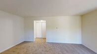 Located at 968 Kings Hwy in West Deptford, NJ, this one-bedroom, one-bathroom residence offers a thoughtfully organized single-floor layout designed for comfortable everyday living. The living room is generously sized, featuring neutral-toned carpet, crisp white walls, and a sliding glass door that invites natural light and provides outdoor access. A dedicated entry area with a closet provides convenient storage upon arrival. The kitchen offers a practical workspace, while the adjacent hallway connects the main living areas efficiently. The spacious primary bedroom is notably large, fitted with soft carpeting, a double sliding-door closet, and a window overlooking the surrounding greenery, allowing for ample natural light. The full bathroom is finished in a clean, all-white palette with mosaic tile flooring, a tub/shower combination, and a luminous ceiling panel that brightens the space. Additional highlights include two closets throughout the unit and a dedicated laundry area, adding to the overall functionality of the home. The interior maintains a consistent, neutral color scheme with light walls and warm carpeting throughout, creating a calm and move-in-ready atmosphere.