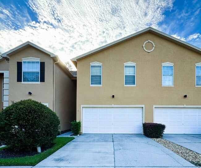 Foto del edificio - Gated Tampa Palms Townhome with 2-Car Garage, Screened Lanai & Community Pool