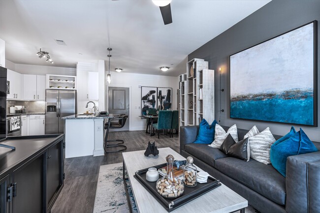 Modern Living Area with Open Floor Plan - Cyan Craig Ranch Apartments