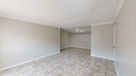 This 870 square foot apartment in Houston, TX offers a well-designed living space with two bedrooms and three bathrooms. The single-story layout maximizes functionality, with a generous 150 square foot primary bedroom. Throughout the apartment, neutral-toned walls and large tiles create a cohesive, modern aesthetic.

The living area is spacious and bright, featuring a large window that allows natural light to flood the room. Ceiling fans in the bedrooms provide additional comfort and air circulation. The kitchen, while compact, offers ample storage with white cabinetry and is equipped with essential appliances. Granite countertops add a touch of elegance to the space.

The bathrooms are well-appointed with clean, white fixtures and tiled surrounds in the shower/tub combinations. Some bathrooms feature granite vanity tops, mirroring the kitchen's design. The apartment also includes two closets for additional storage.

The property at 2929 Dunvale Rd benefits from its location in the 77063 zip code of Houston, offering residents convenient access to urban amenities. With its practical layout and modern finishes, this apartment provides a comfortable living environment in a desirable area of the city.